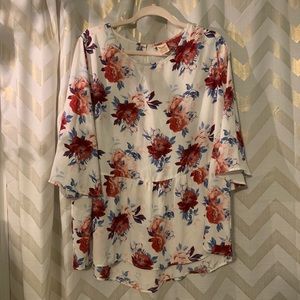 Flowy and floral peplum blouse